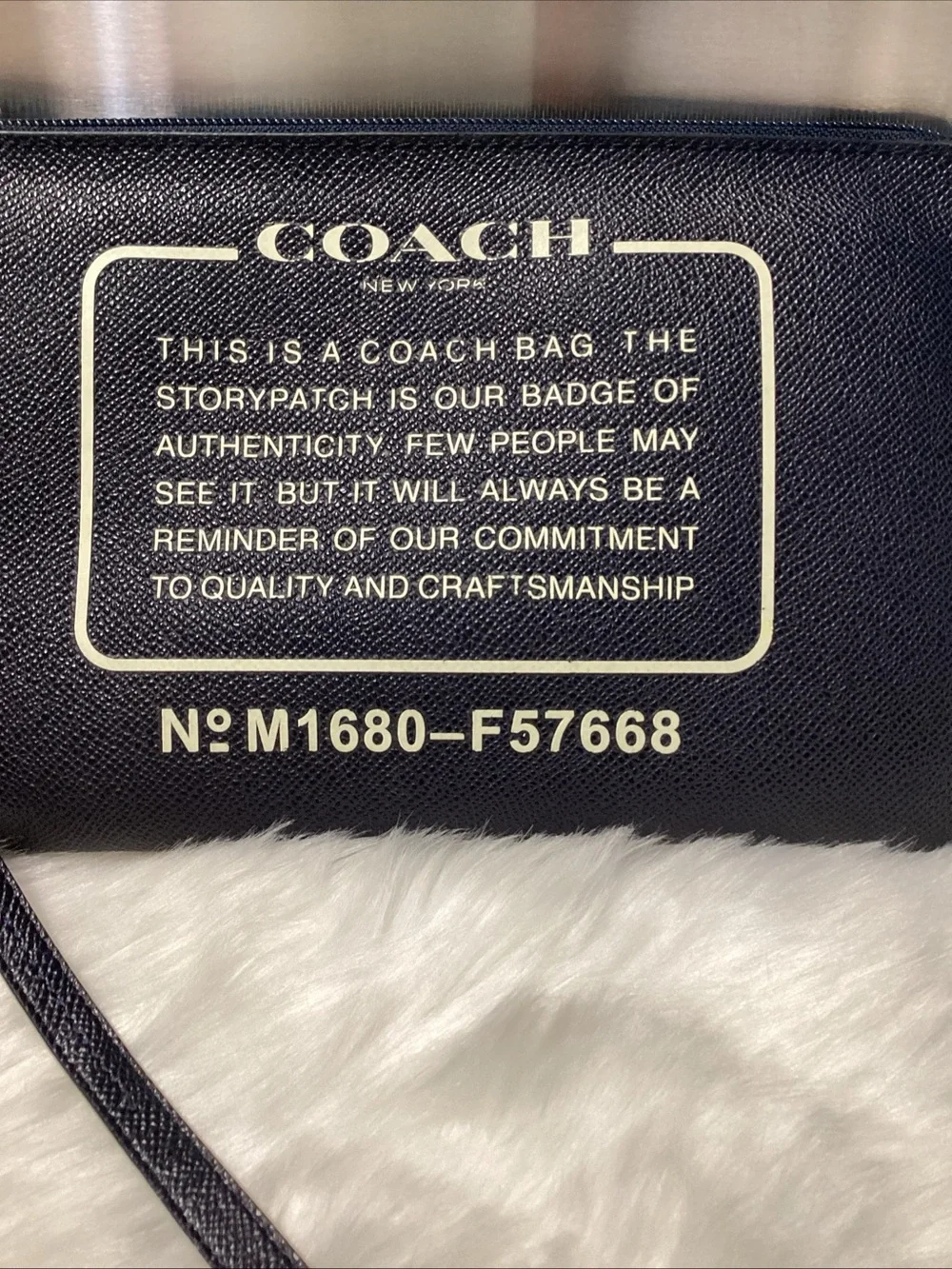 Coach Navy Wristlet with Cream Logo Text